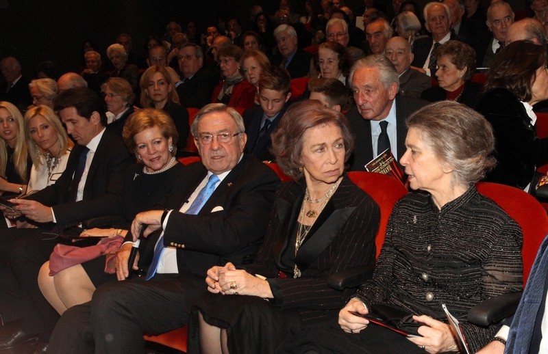 Queen Sofia speaking with her sister, Princess Irene, and sitting next to King Constantine.